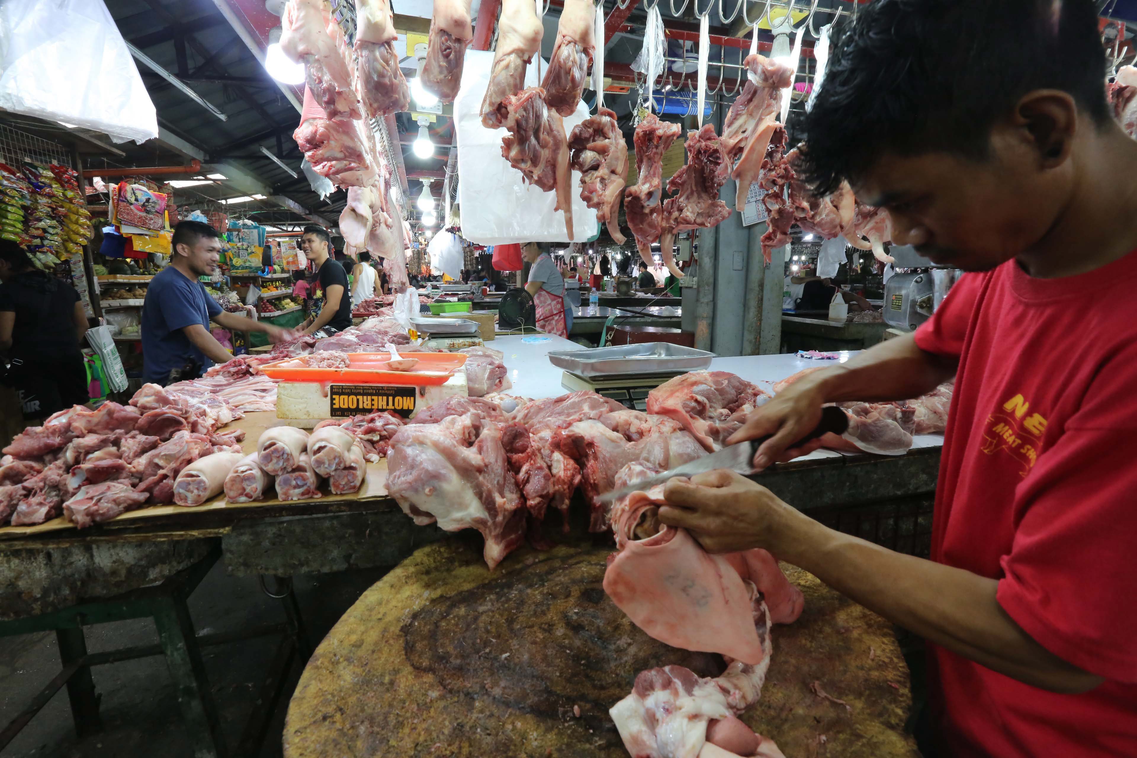 A vendor sells pork on Sept. 9, 2019 amid concerns over the spread of African swine fever in the country. Photo by Boy Santos, The Philippine STAR