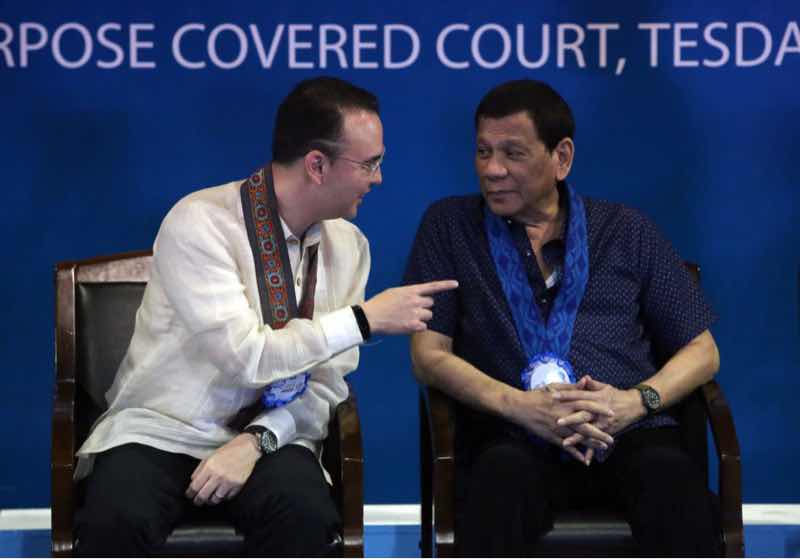 President Duterte and Speaker Alan Peter Cayetano talk during the launching of “911 TESDA,” a Grab-like application providing graduates of the Technical Education and Skills Development Authority a platform to land a job with just a swipe, at the TESDA complex in Taguig City on July 30, 2019. Photo by KJ Rosales, The Philippine STAR