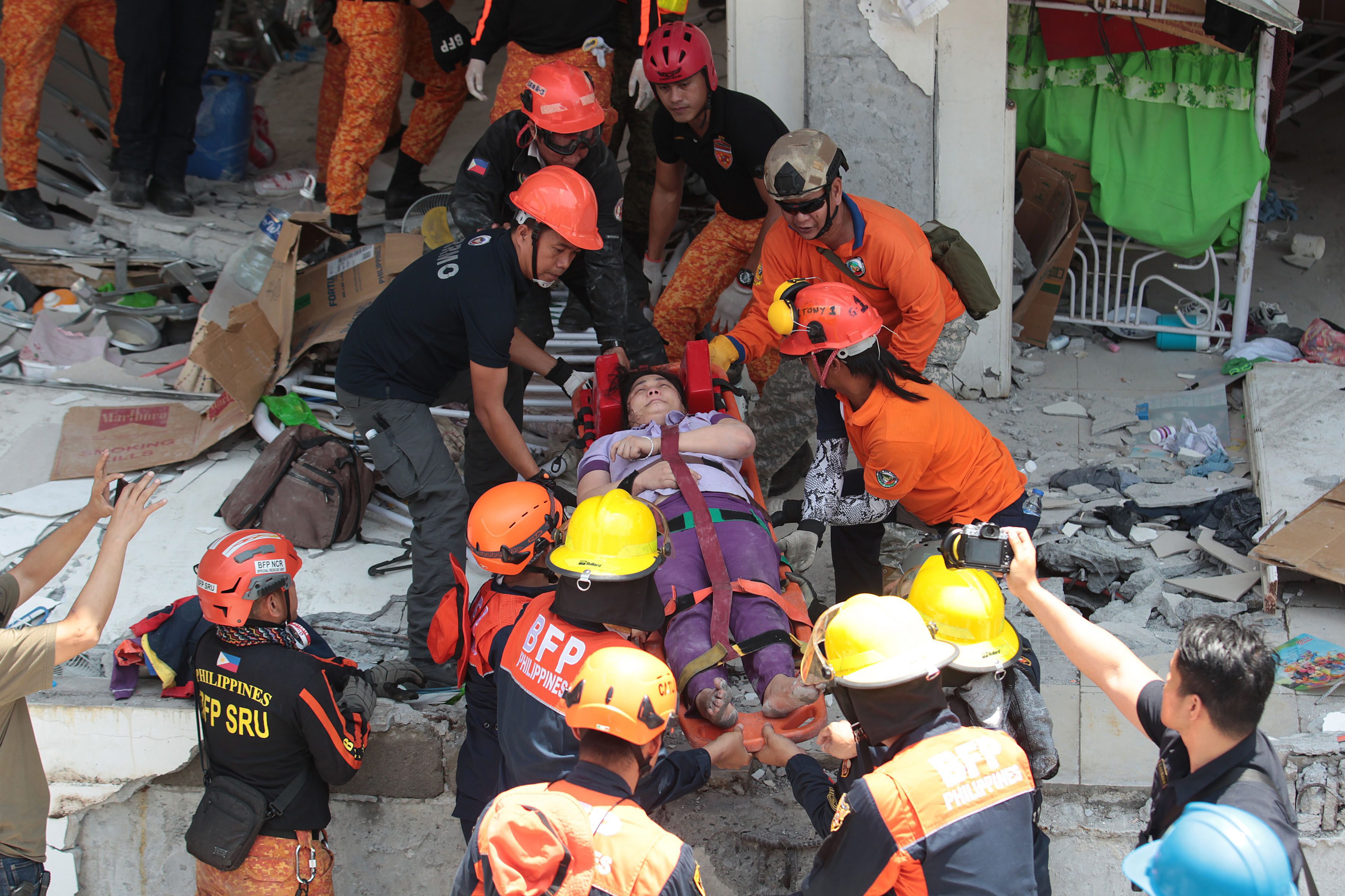 An earthquake survivor is evacuated from a collapsed building in Porac, Pampanga on April 22, 2019. Photo by Michael Varcas, The Philippine STAR
